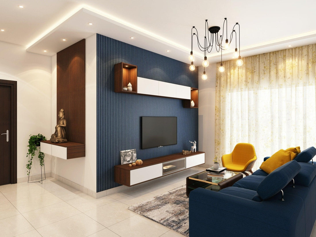 Modern living room with blue accent wall, TV, yellow armchair, blue sofa, and contemporary decor