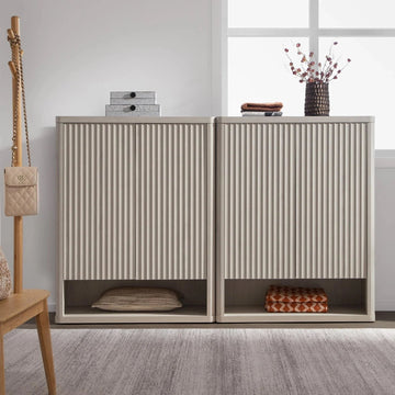 Modern wooden shoe storage cabinet with vertical grooves in a bright entryway