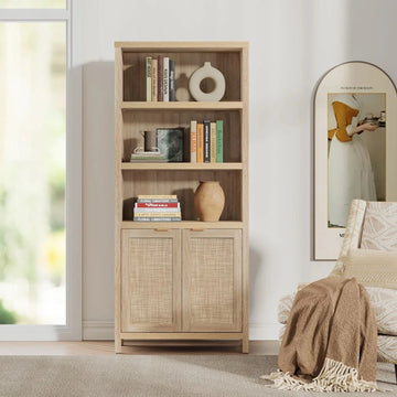Light wood bookcase with shelves of books, decor, and cabinet doors in modern living room