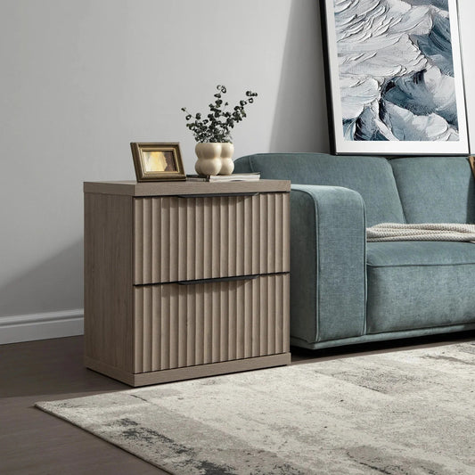 Modern wood nightstand with vertical grooves beside a teal sofa in living room setting