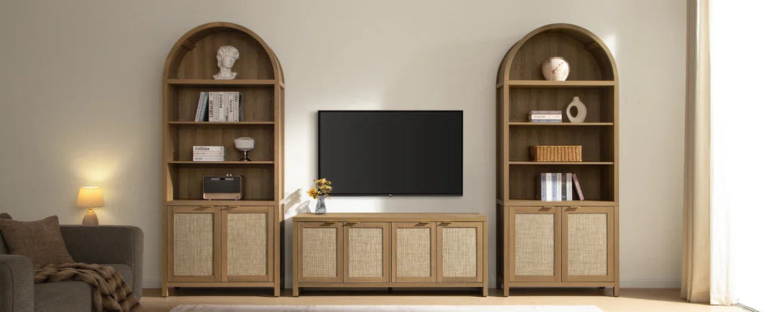 Modern living room with wooden TV console, arch bookshelves, and home decor accents.