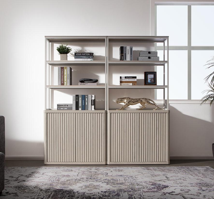 Modern entryway with beige shelving, books, gold panther sculpture, and decorative accents