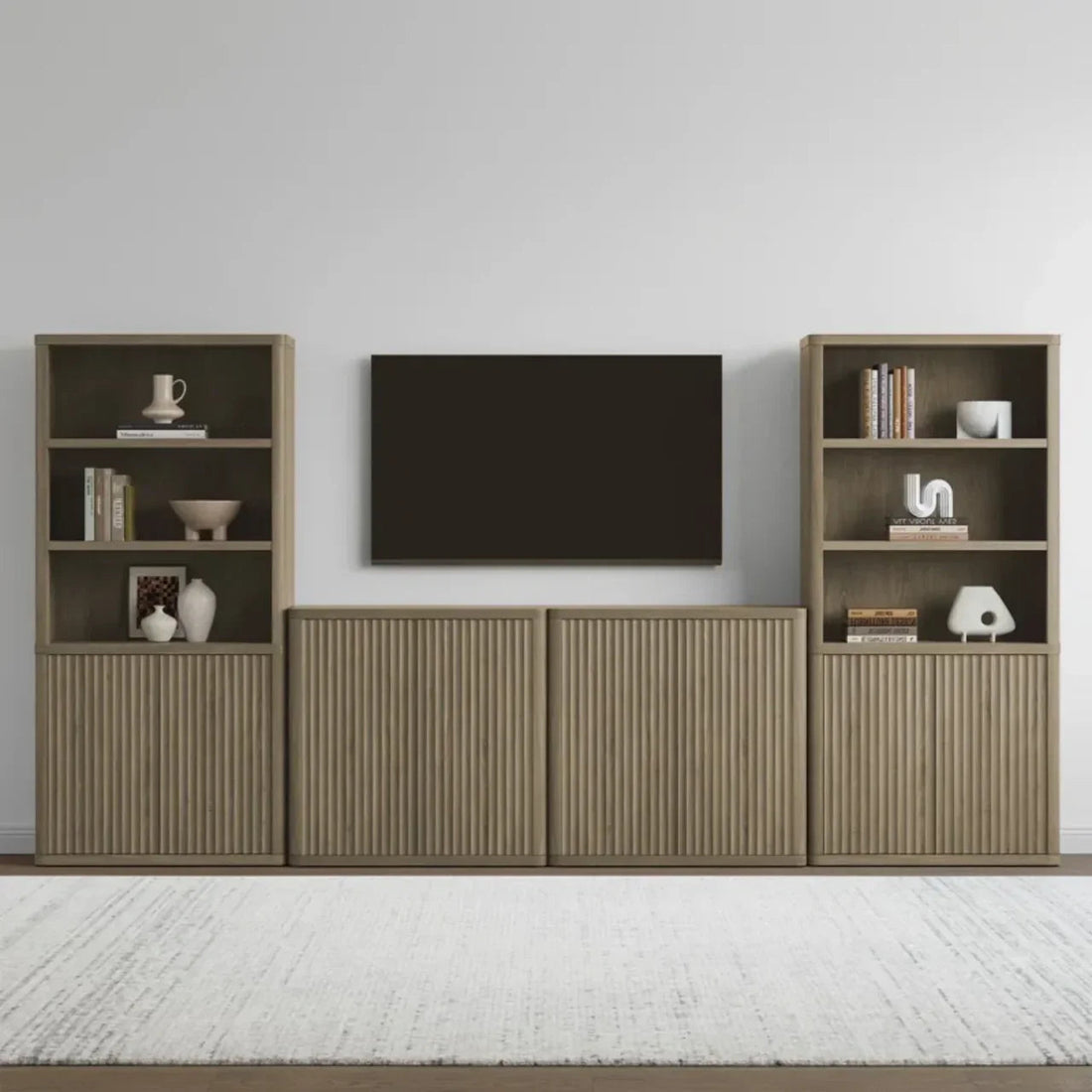 Modern living room with wood media console, open shelves, and wall-mounted TV