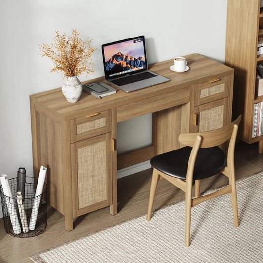 Modern wooden desk with laptop, coffee cup, vase, and chair in a home office setup
