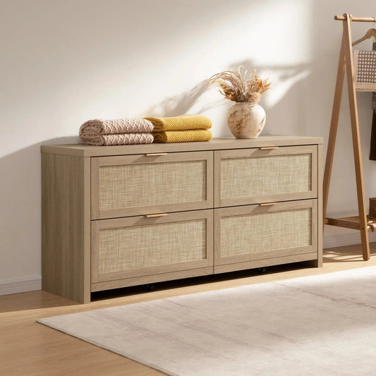Modern interior with rattan-fronted wooden cabinet, neutral rug, folded blankets, and vase