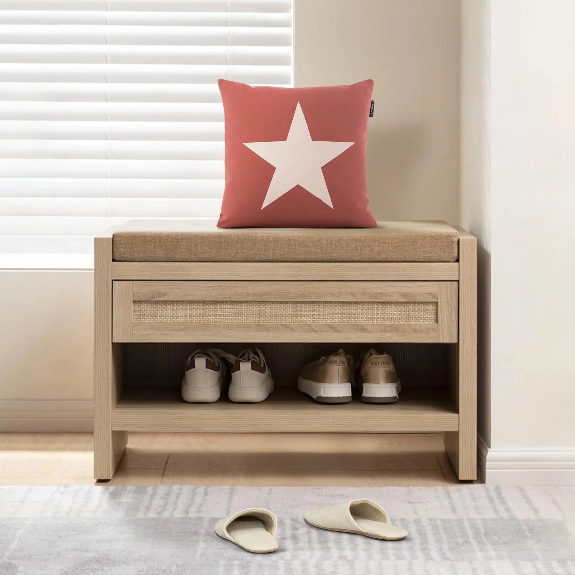 Wooden entryway bench with cushion, red star pillow, sneakers and slippers, bright window.