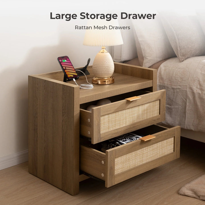 Wooden nightstand with rattan mesh drawers, lamp, phone, and storage beside bed