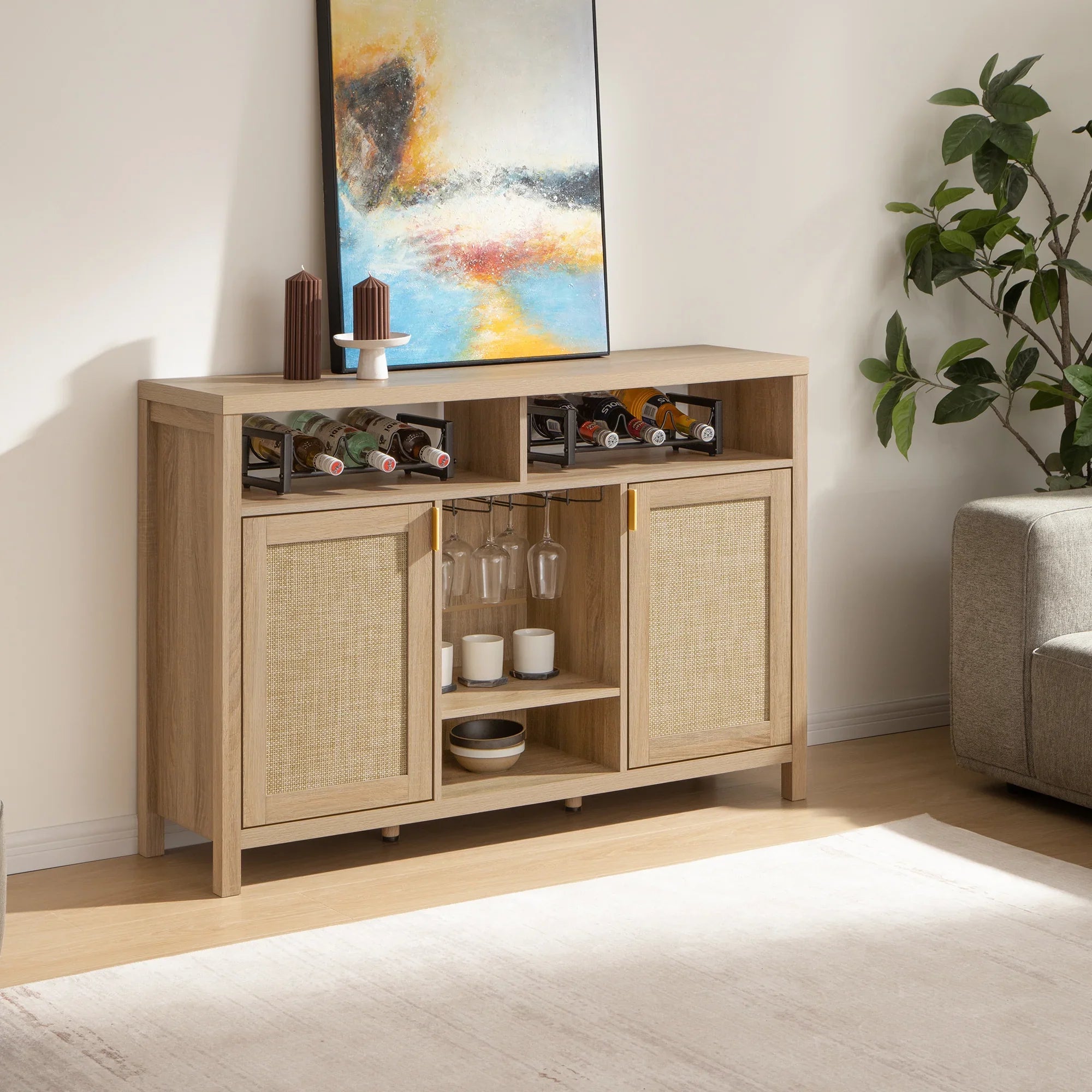 Modern wooden sideboard with wine rack, glasses, abstract art, and decor in a cozy living room