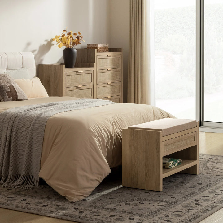 Modern bedroom with beige bedding, wooden furniture, bench, dresser, and large window