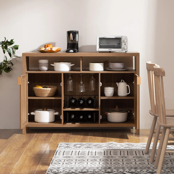 Wood kitchen sideboard with toaster, coffee maker, cookware, wine bottles, and open shelves