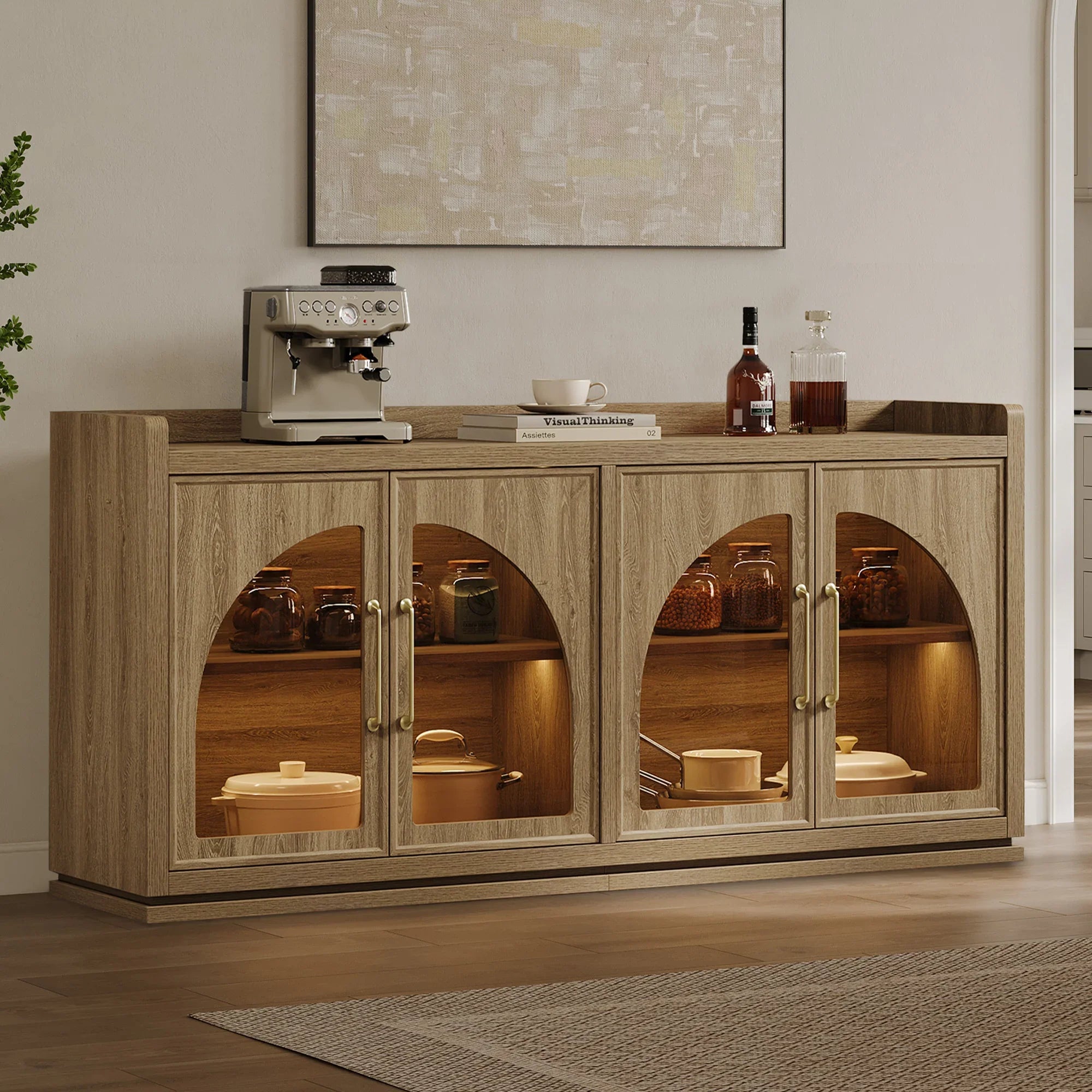 Dark gray wooden sideboard with arched glass doors, interior lighting, and decorative items on top, used in living or dining areas.