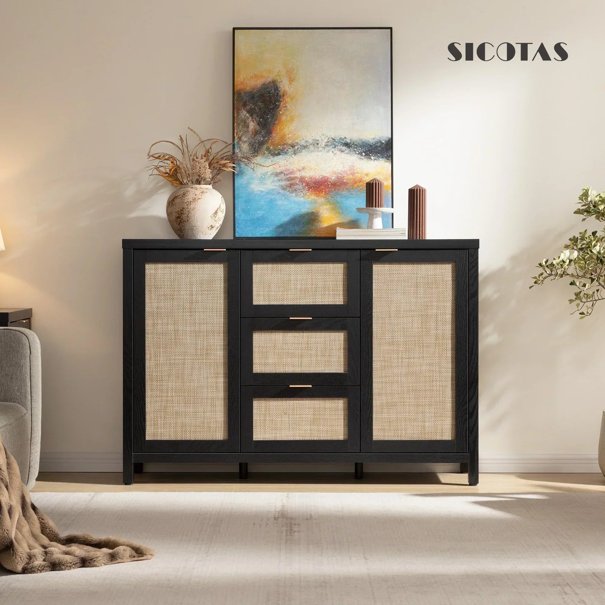 Modern black sideboard with rattan panels, abstract painting, and decorative vase in living room