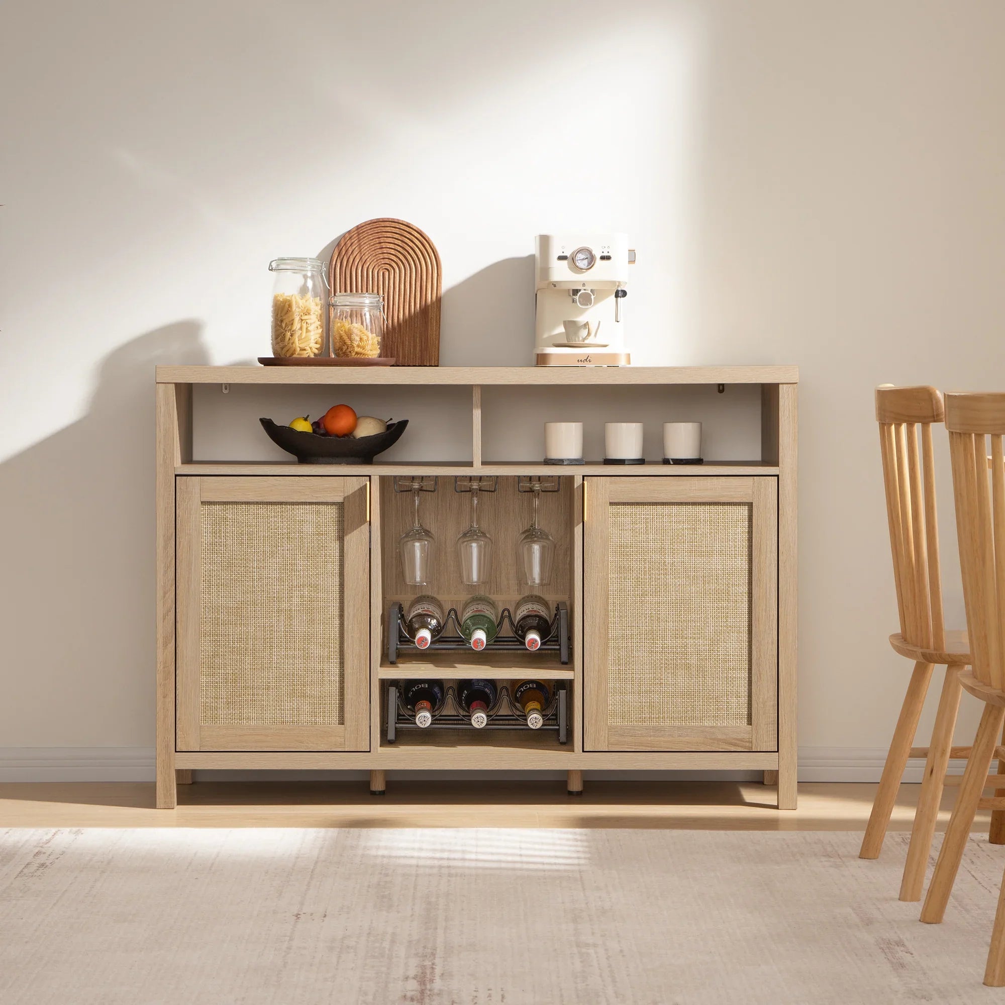 Modern light wood sideboard with wine rack, glassware, coffee maker and kitchen decor