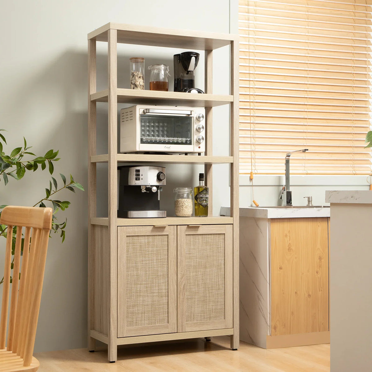 Modern kitchen with light wood pantry cabinet, coffee maker, toaster oven, jars, and decor.