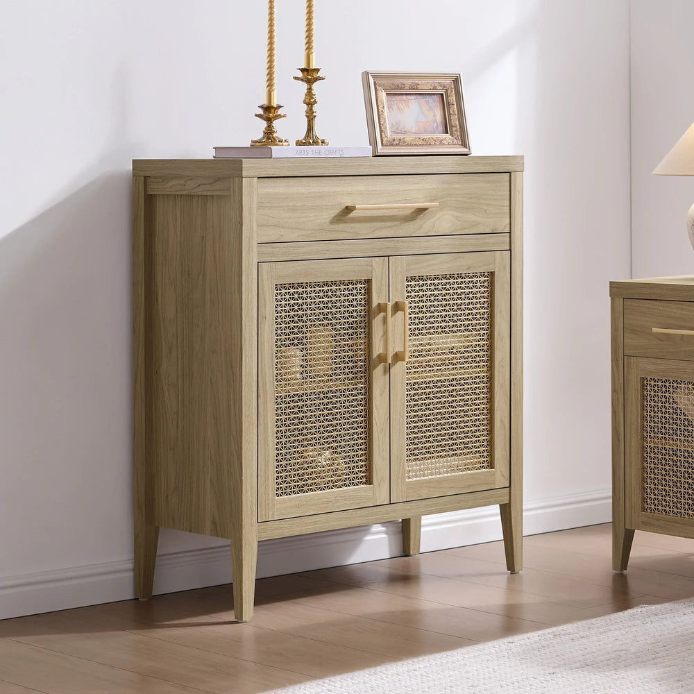Natural wood storage cabinet with rattan doors, gold handles, and decorative accents