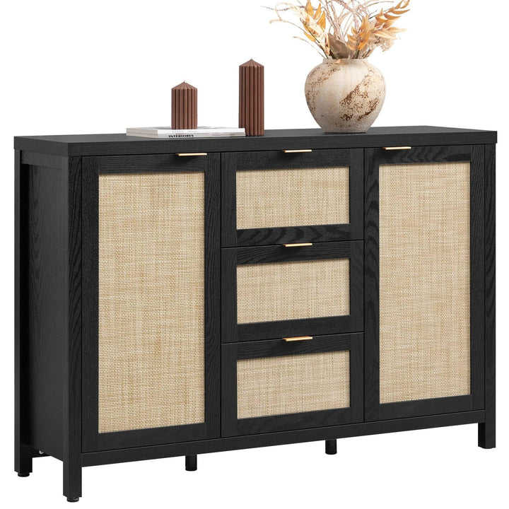 Modern black sideboard with rattan doors, three drawers, decor vase and candles on top