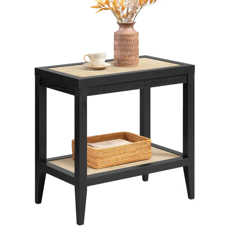 Black wood and rattan side table with vase, cup, and woven storage basket
