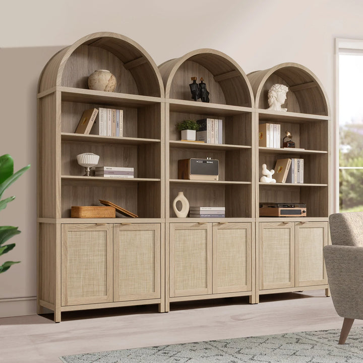 Modern light wood arched bookshelf with decor, books, and cabinets in a bright living room