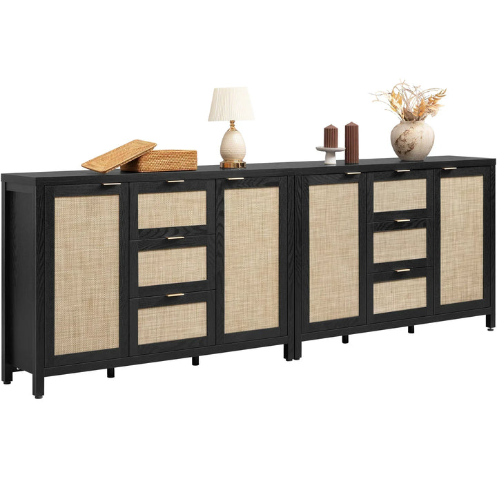 Modern black and rattan sideboard cabinet with lamp, vases, baskets, and candles on top