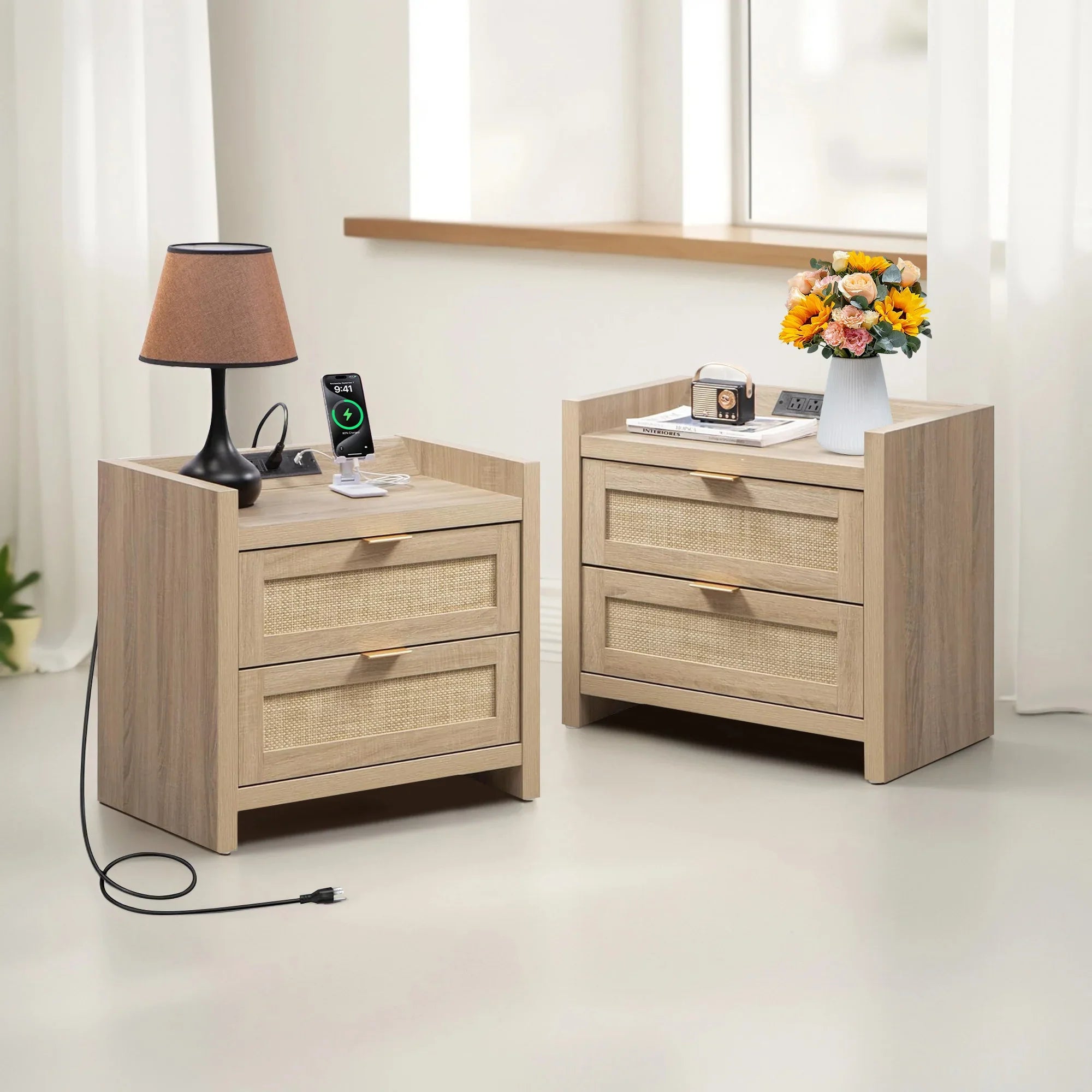 Set of two modern wooden nightstands with drawers, lamp, phone, books, and flower vase