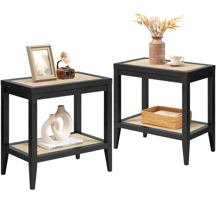 Pair of black rattan side tables with decor, including a vase, framed photo, and basket