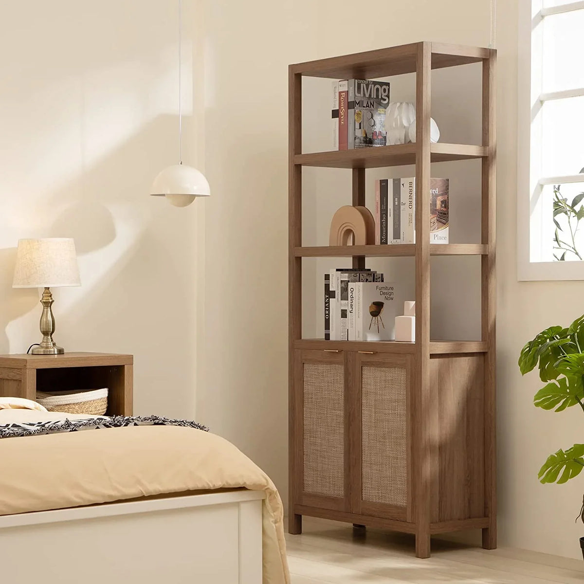 Modern wooden bookshelf with rattan doors in cozy bedroom interior, books and decor displayed