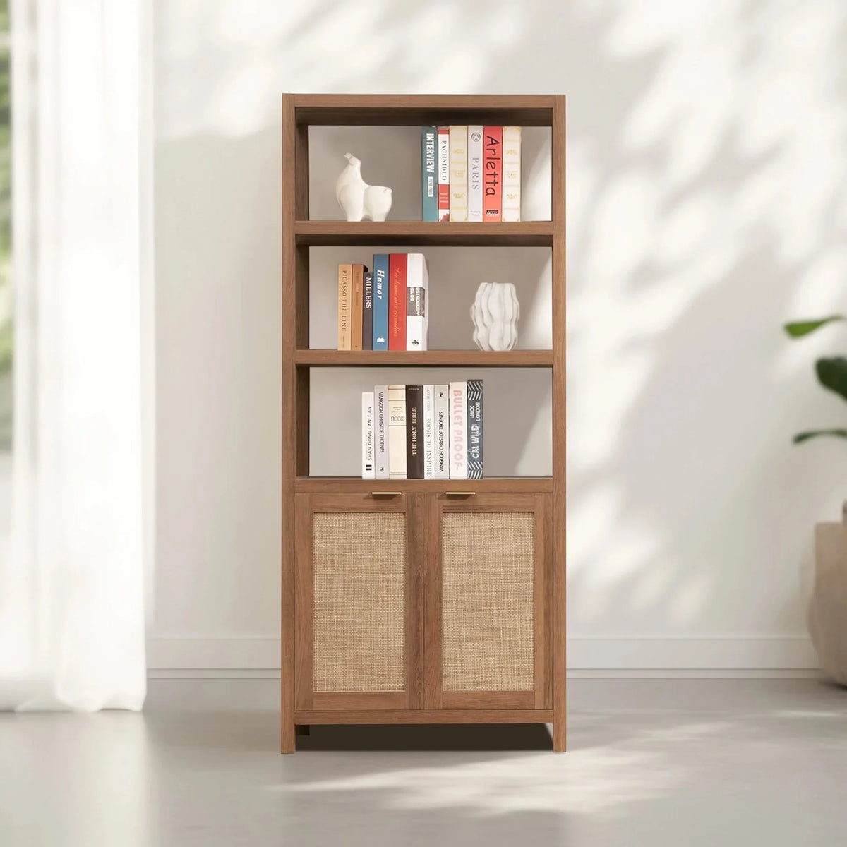 Modern wooden bookshelf with books, decorative vases, and woven cabinet doors in a bright room