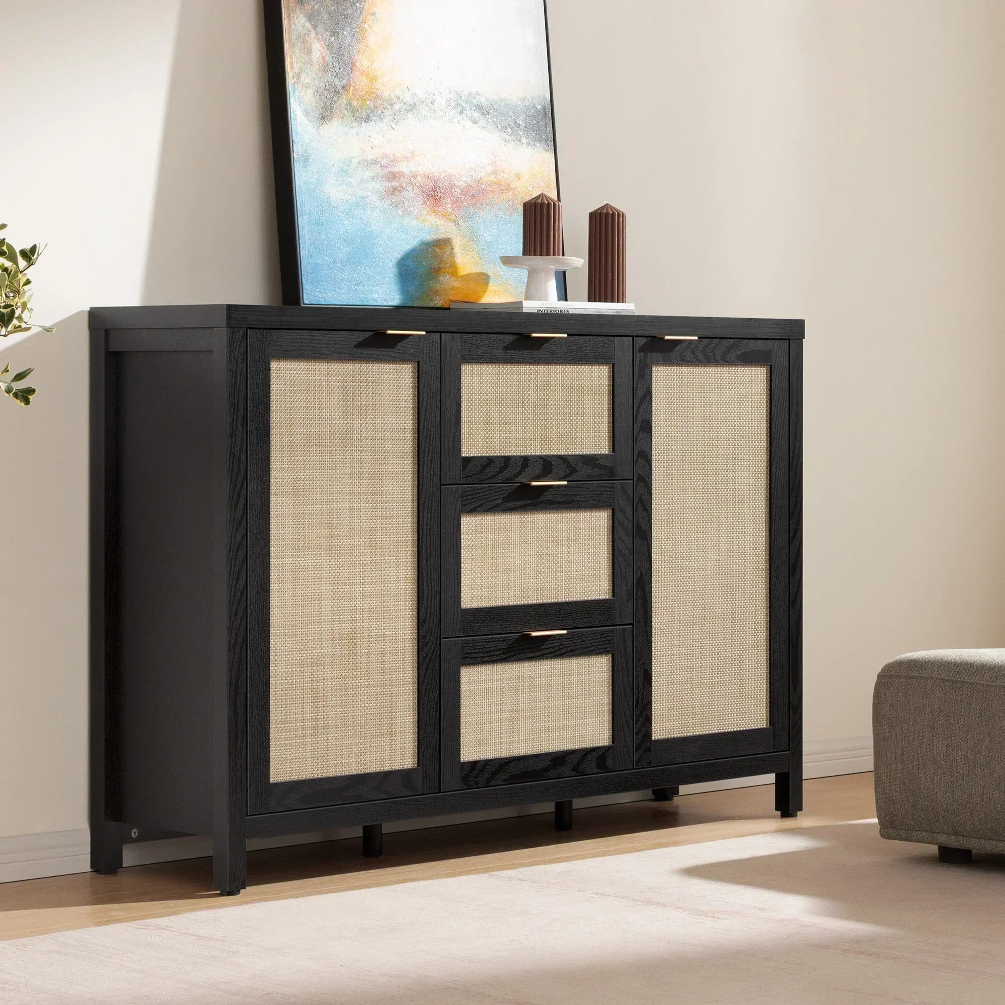 Black and rattan sideboard dresser in modern living room with abstract painting decor