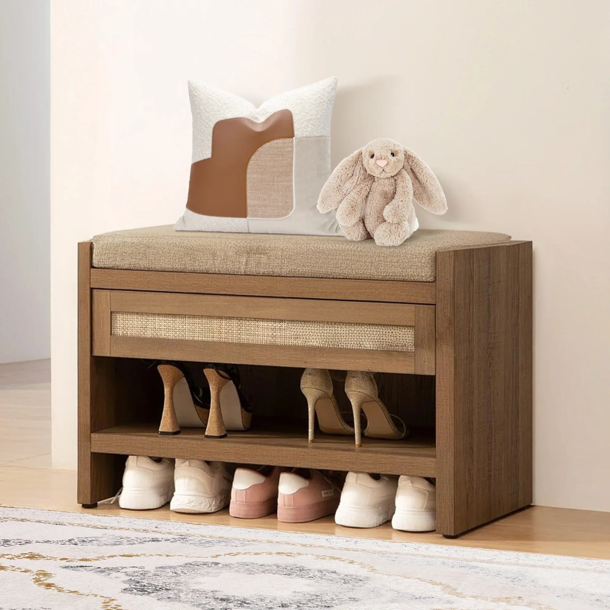 Modern wooden shoe bench with cushion, abstract pillow, plush bunny, and organized shoes