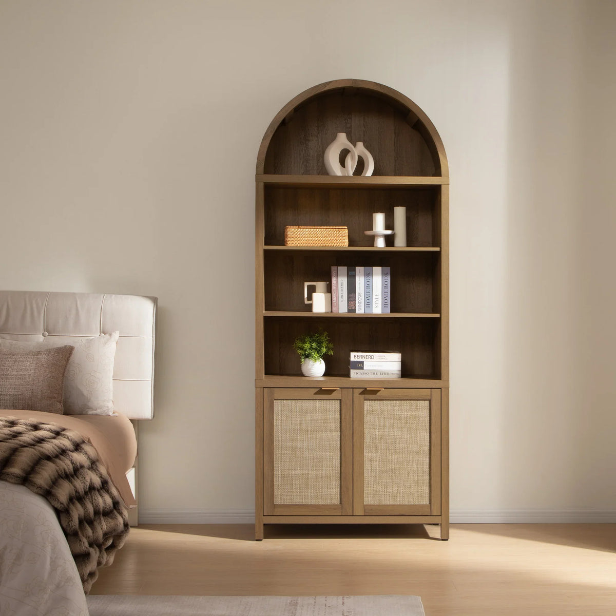 Modern wood bookshelf with arch, books, decor, and cabinet in cozy bedroom setting