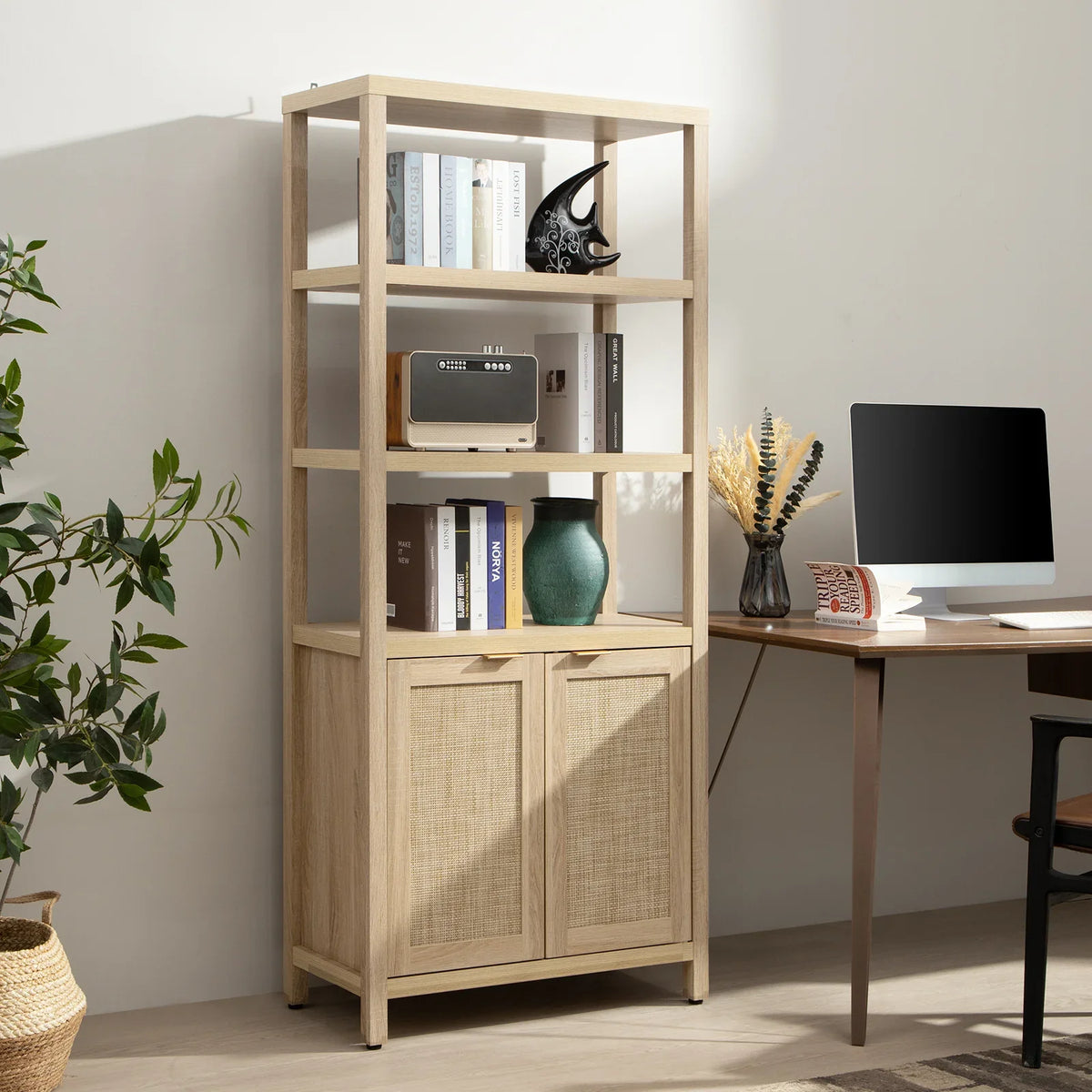 Modern home office with light wood bookshelf, books, decor, desk, and computer