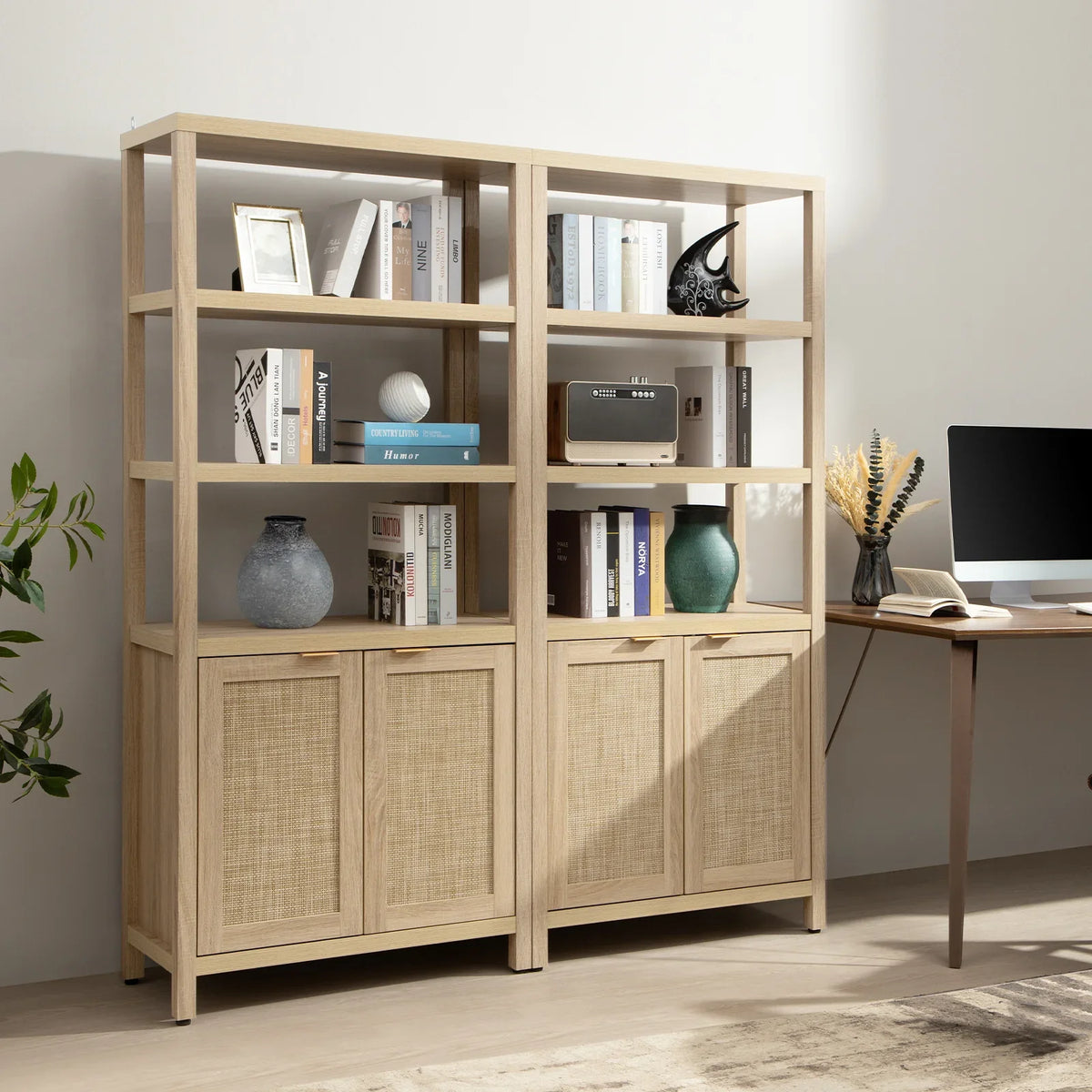Modern light wood bookcase with rattan doors, books, vases, decor, and desk setup in home office
