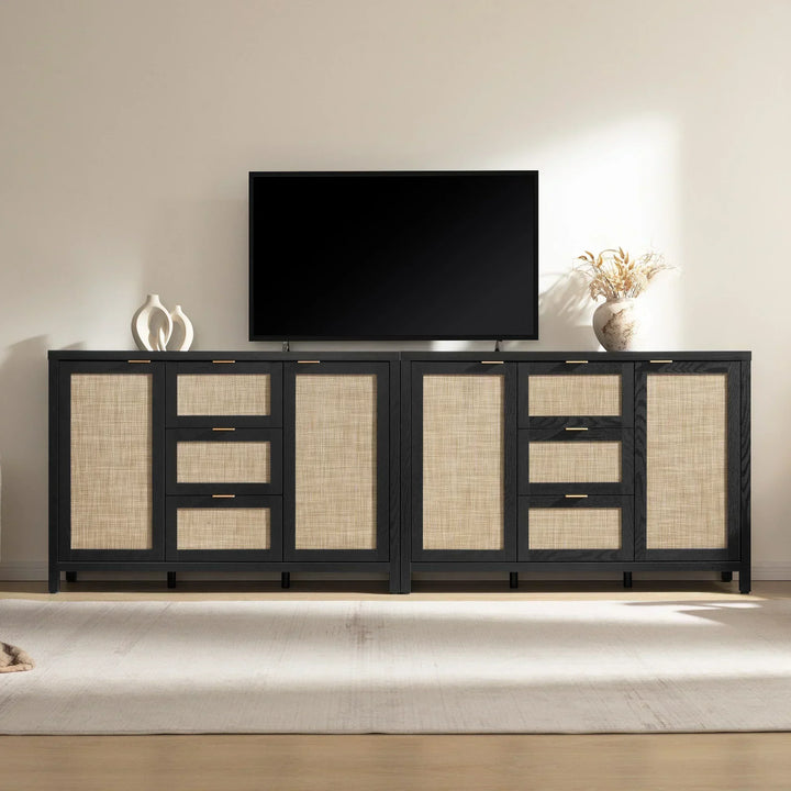 Modern black and rattan TV console with storage drawers, minimalist decor, flat-screen TV
