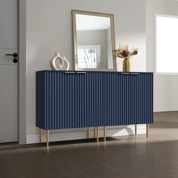 Modern blue sideboard with gold legs, vases, and mirror in a bright living room