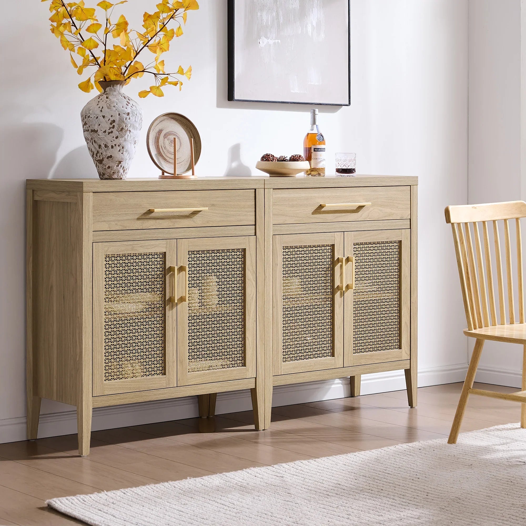 Modern oak sideboard with rattan doors, autumn vase, and decor in bright living room