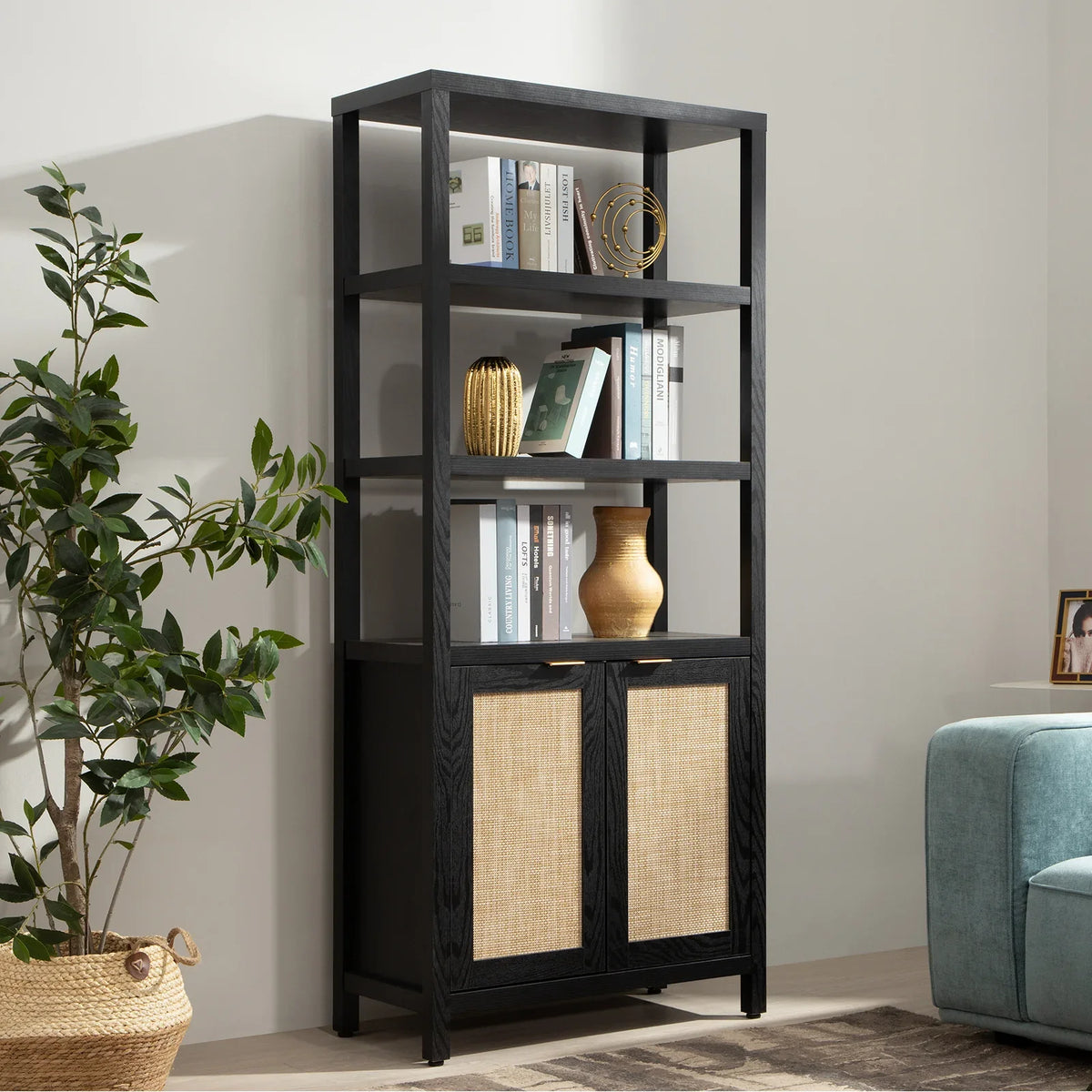 Modern black wood bookshelf with books, decor, woven cabinet doors in stylish living room