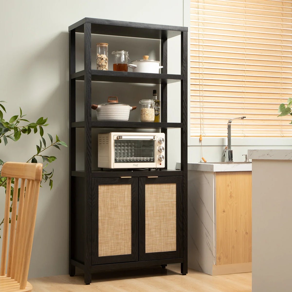 Modern kitchen with black wood storage shelf, countertop oven, and rattan cabinet doors