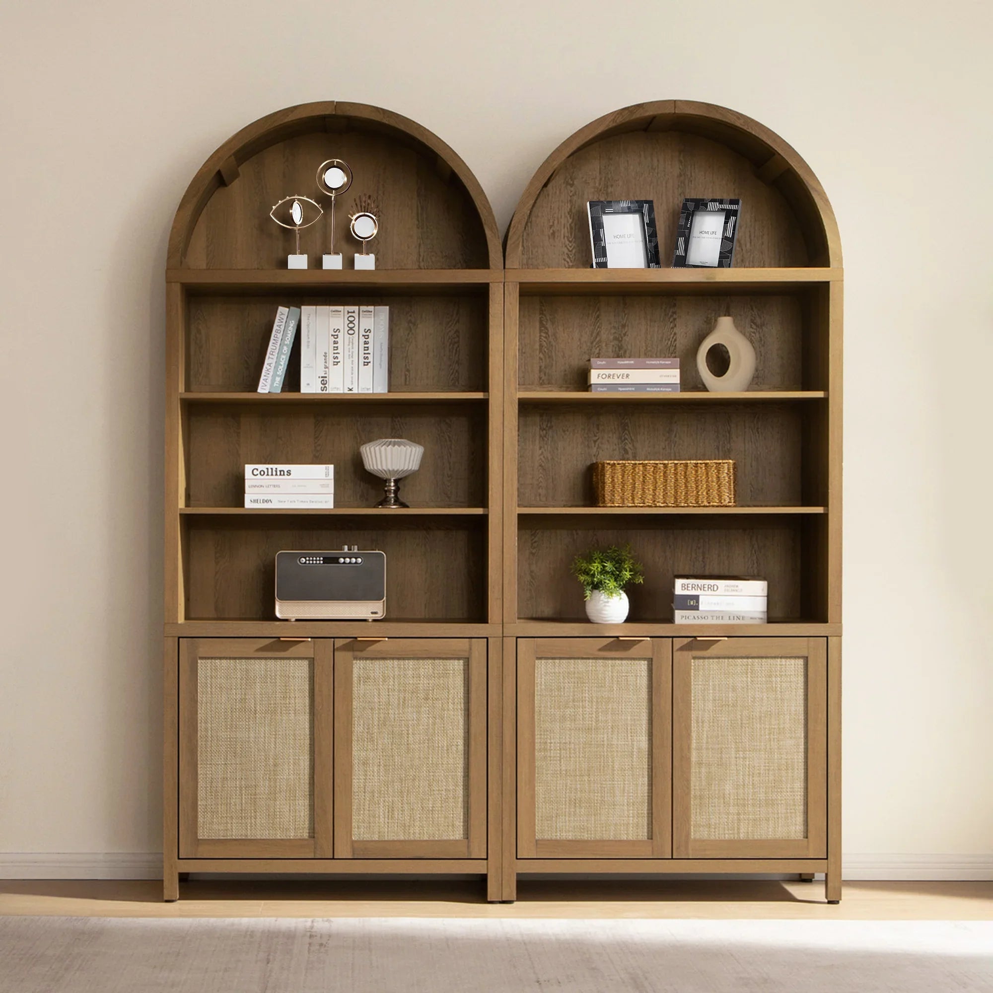 Modern wooden bookshelf with arch shelves, decor items, books, baskets, and cabinets