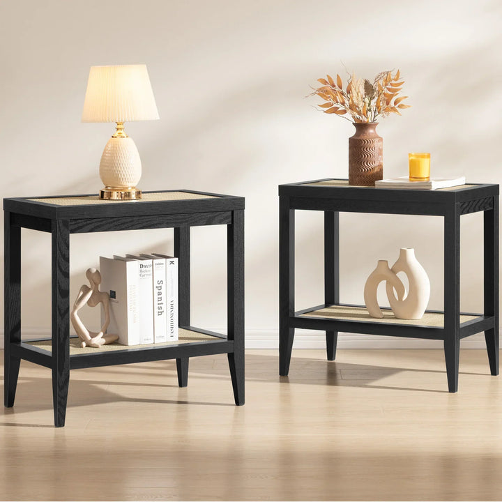 Modern black side tables with books, decorative vases, lamp, and dried floral arrangement