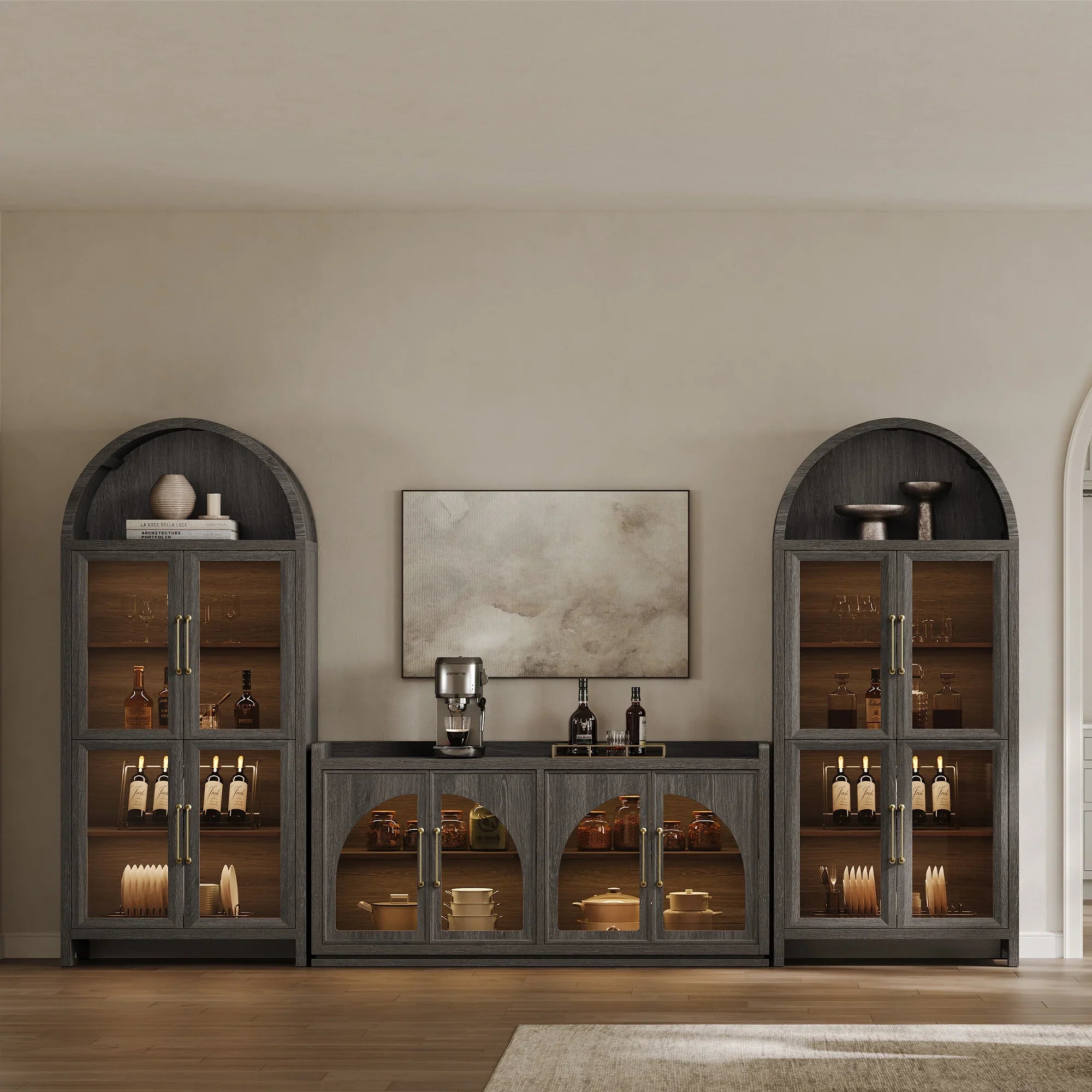 Light wood-colored wooden display cabinet with arched glass doors and interior lighting, used for showcasing decorative items or dishes.
