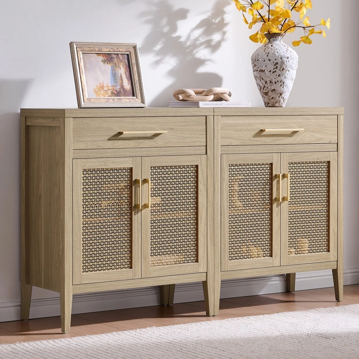 Light wood sideboard with rattan cabinet doors, decorative vase, and framed artwork