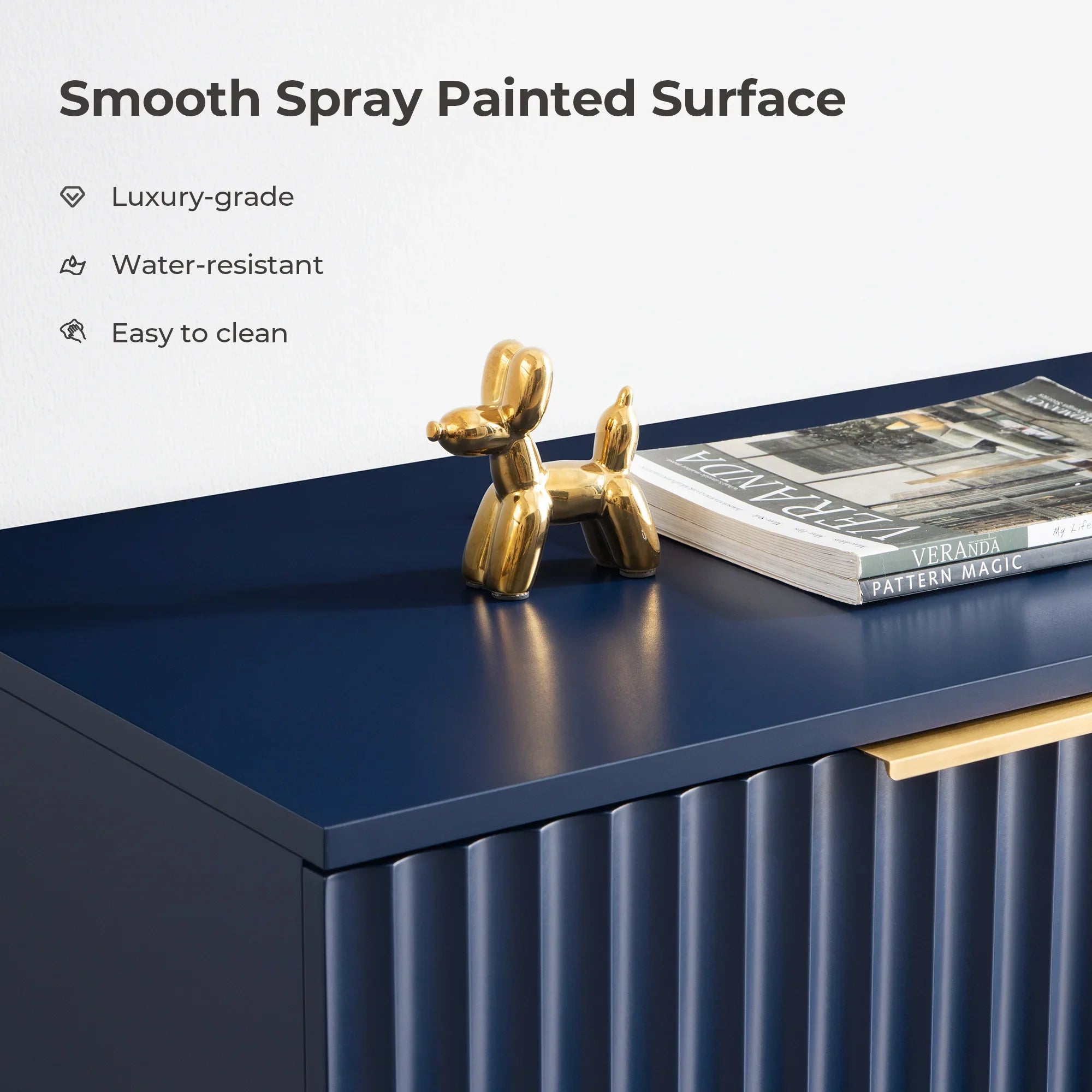 Navy blue cabinet with smooth spray painted surface, gold balloon dog sculpture, books on top.