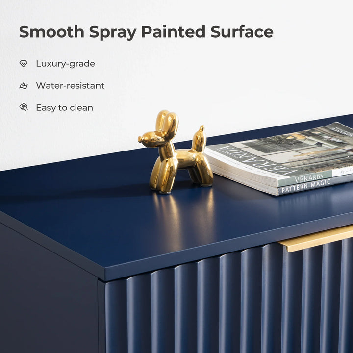 Navy blue cabinet with smooth spray painted surface, gold balloon dog sculpture, books on top.