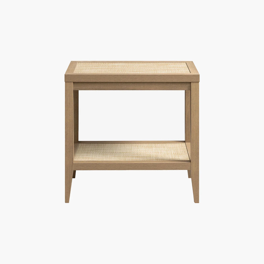 Wooden nightstand with rattan top and shelf, minimalist design, on white background.