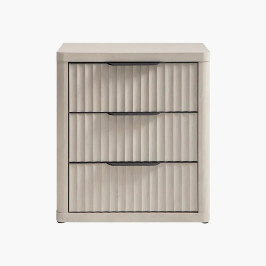 Light wood three-drawer nightstand with vertical grooves and black handles
