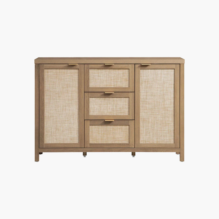 Modern sideboard with light wood frame, rattan panels, and gold handles on white background