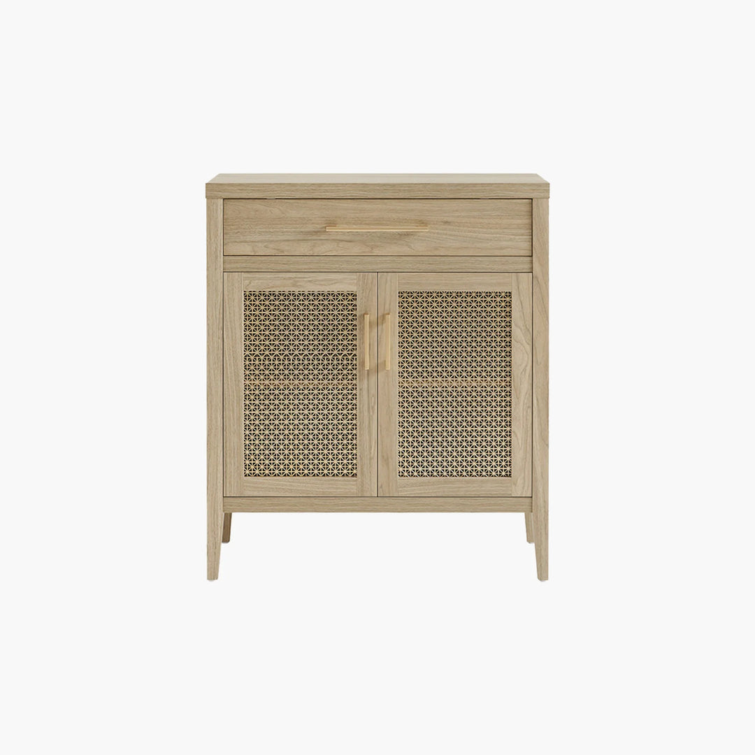 Light wood accent cabinet with cane doors and gold handles on white background