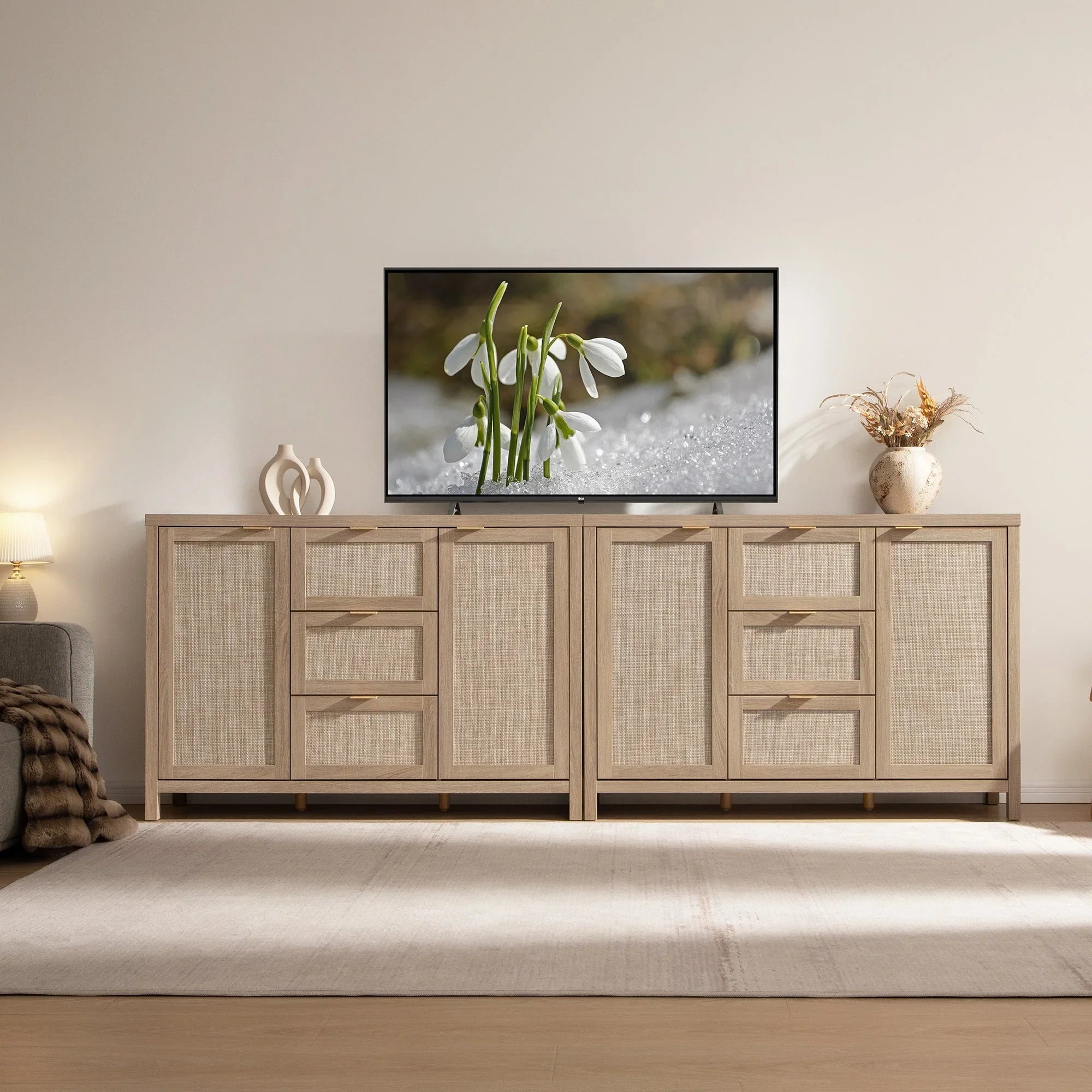 Modern living room with light wood savanna sideboard, TV, table lamp and decorative vase
