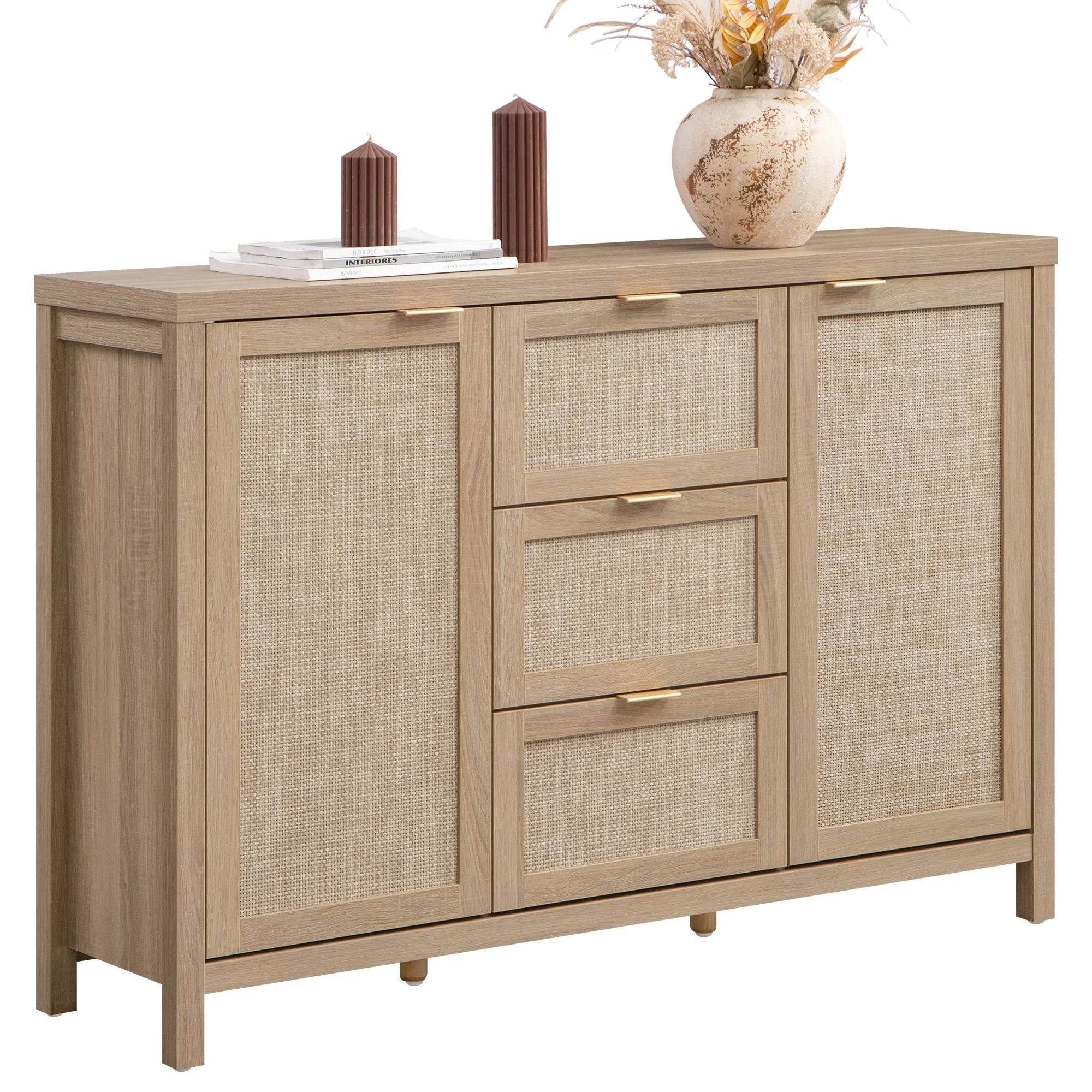 Modern rattan sideboard cabinet with drawers, styled with books, candles, and a vase